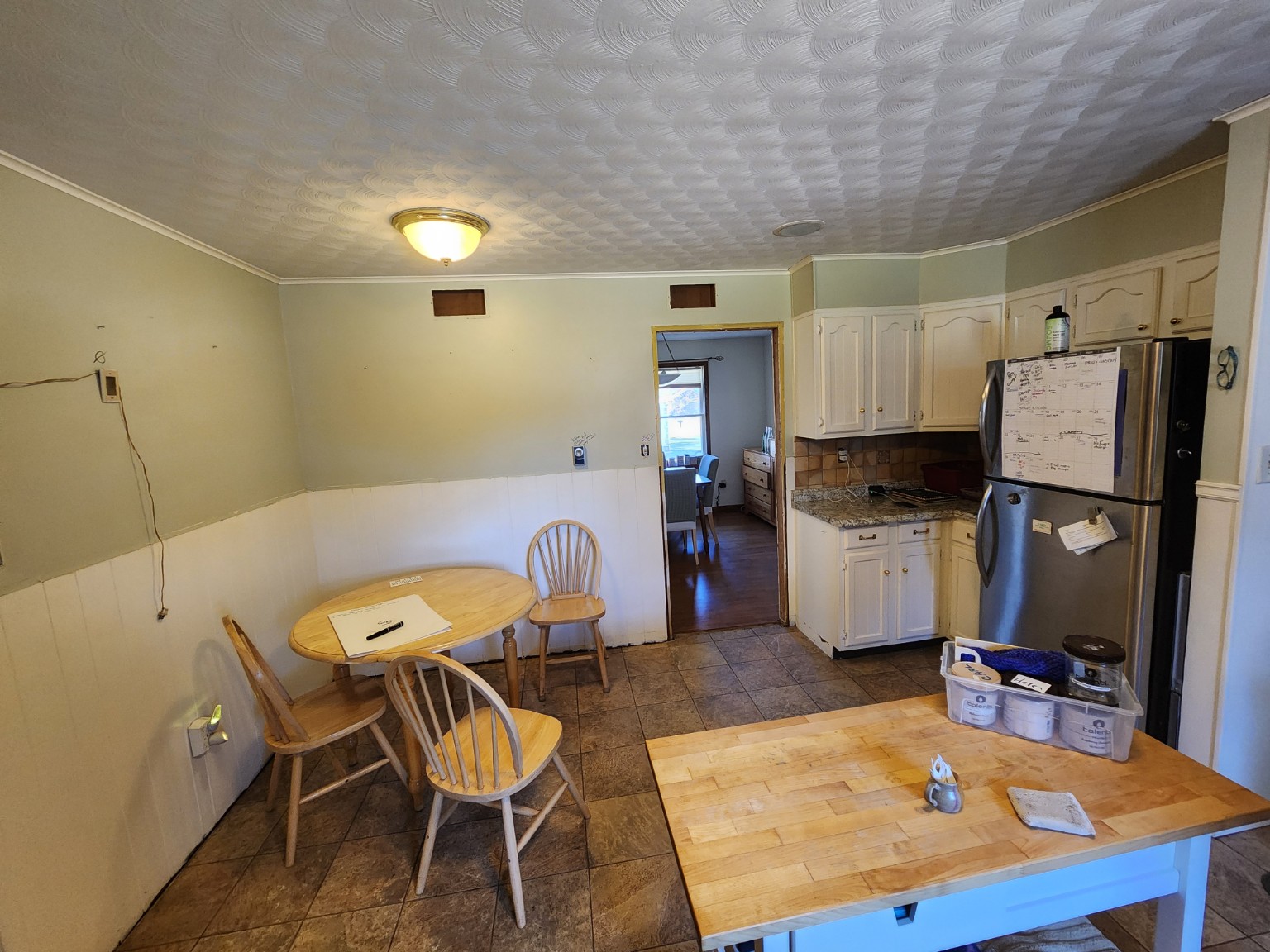 Before — kitchen and wall separating the dining room