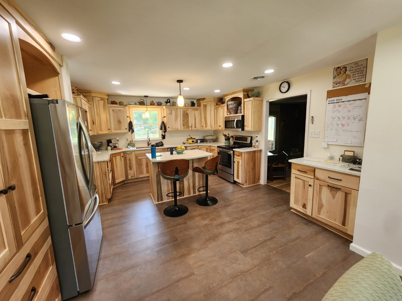 After — new kitchen layout and LVT flooring