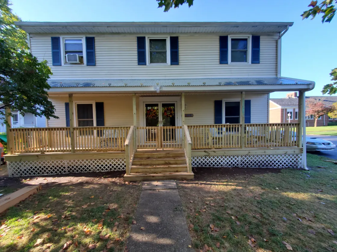 Wood deck and steps along a home's front porch